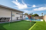 Large heated pool with putting green